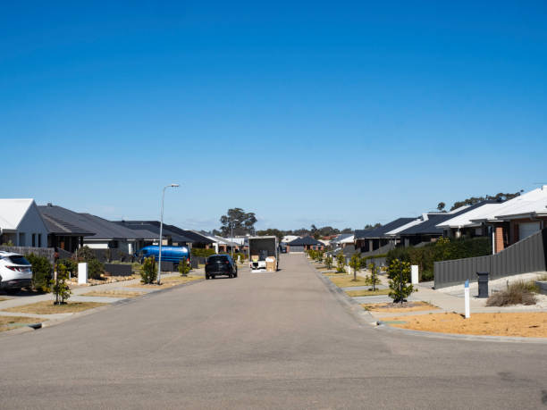 Moving van on street in new housing development